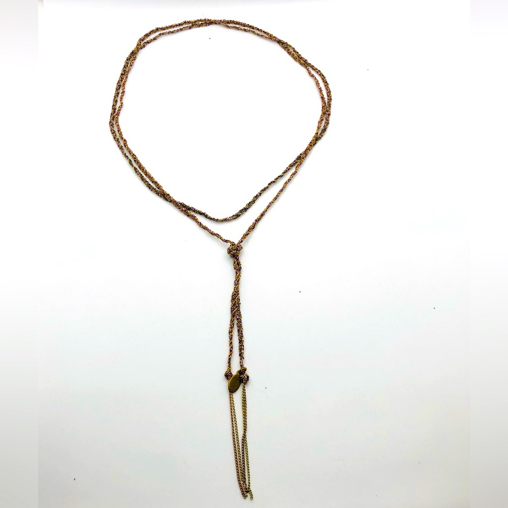 Sogoli necklace/ bracelet that is gold/purple.